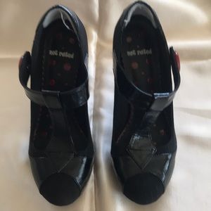 Black pinstripe with red button and heel accents